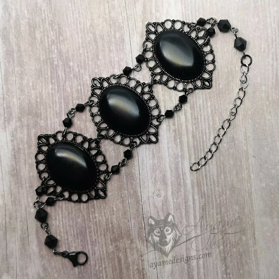 Handmade gothic bracelet with black resin cabochons in black filigree frames, and black Austrian crystal beads