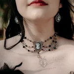Handmade adjustable Victorian gothic choker necklace with grey and black Austrian crystal beads and a cameo pendant in a filigree frame
