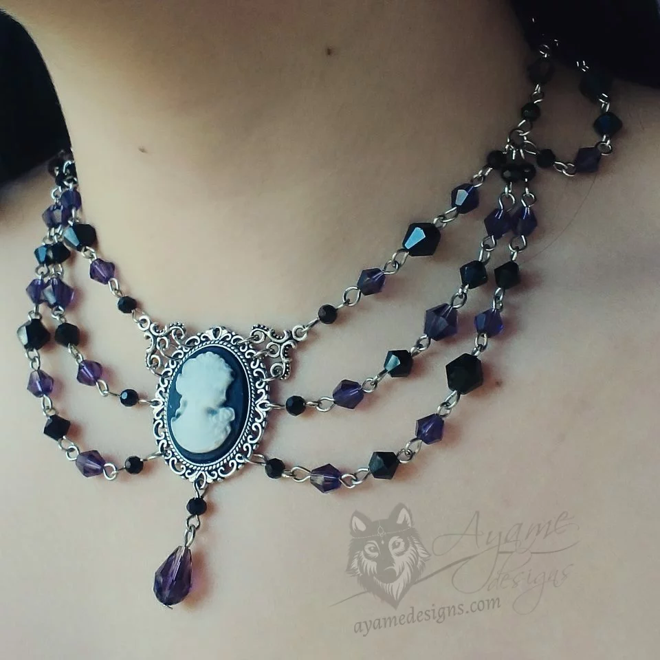 Handmade adjustable Victorian gothic choker necklace with purple and black Austrian crystal beads and a cameo pendant in a filigree frame