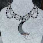 Gothic beaded choker necklace made of stainless steel with grey Czech crystal and black Austrian crystal beads, and a large laser cut mirror moon pendant