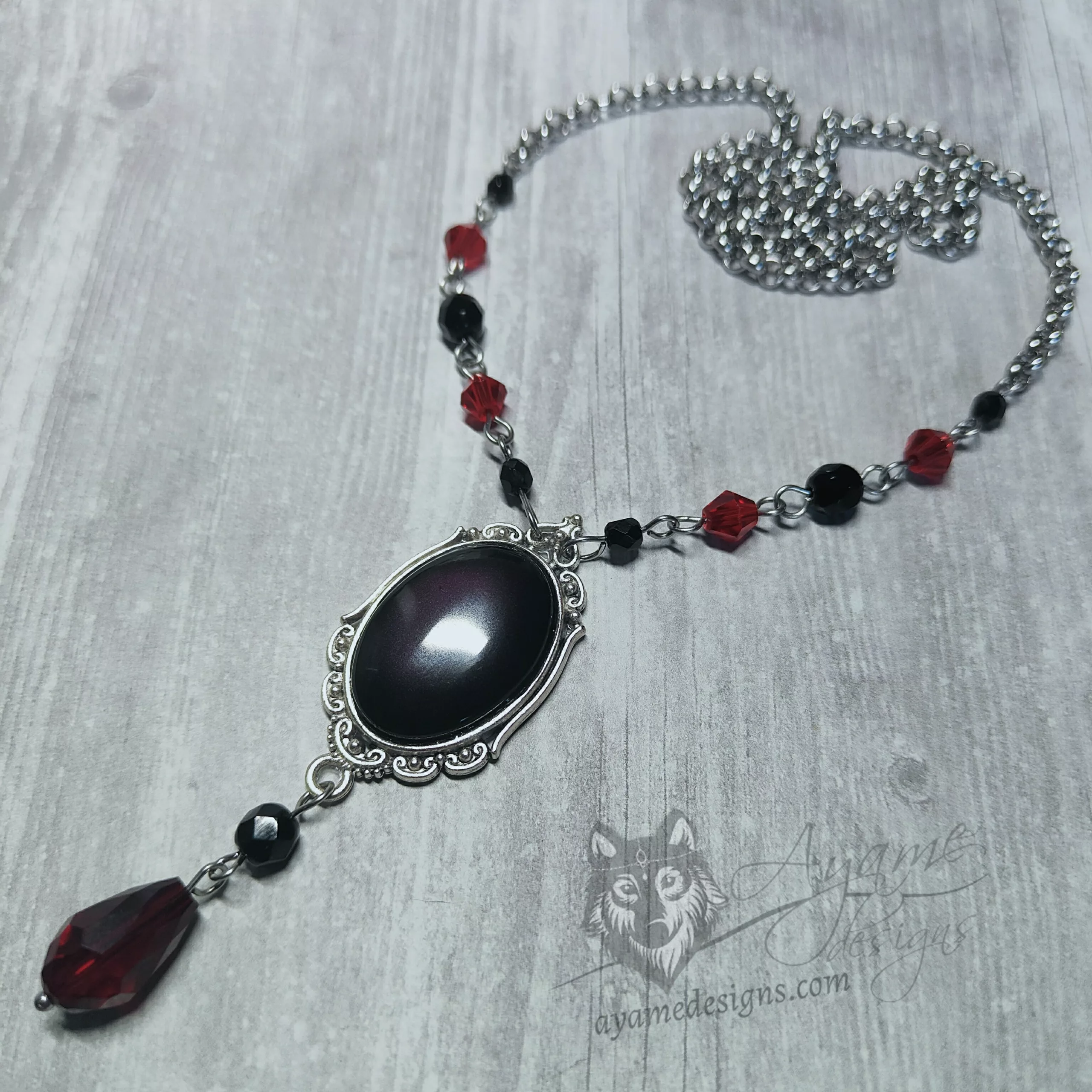 Handmade gothic circlet / head chain with a black resin cameo in a filigree frames, black Czech crystal beads and red Austrian crystal beads