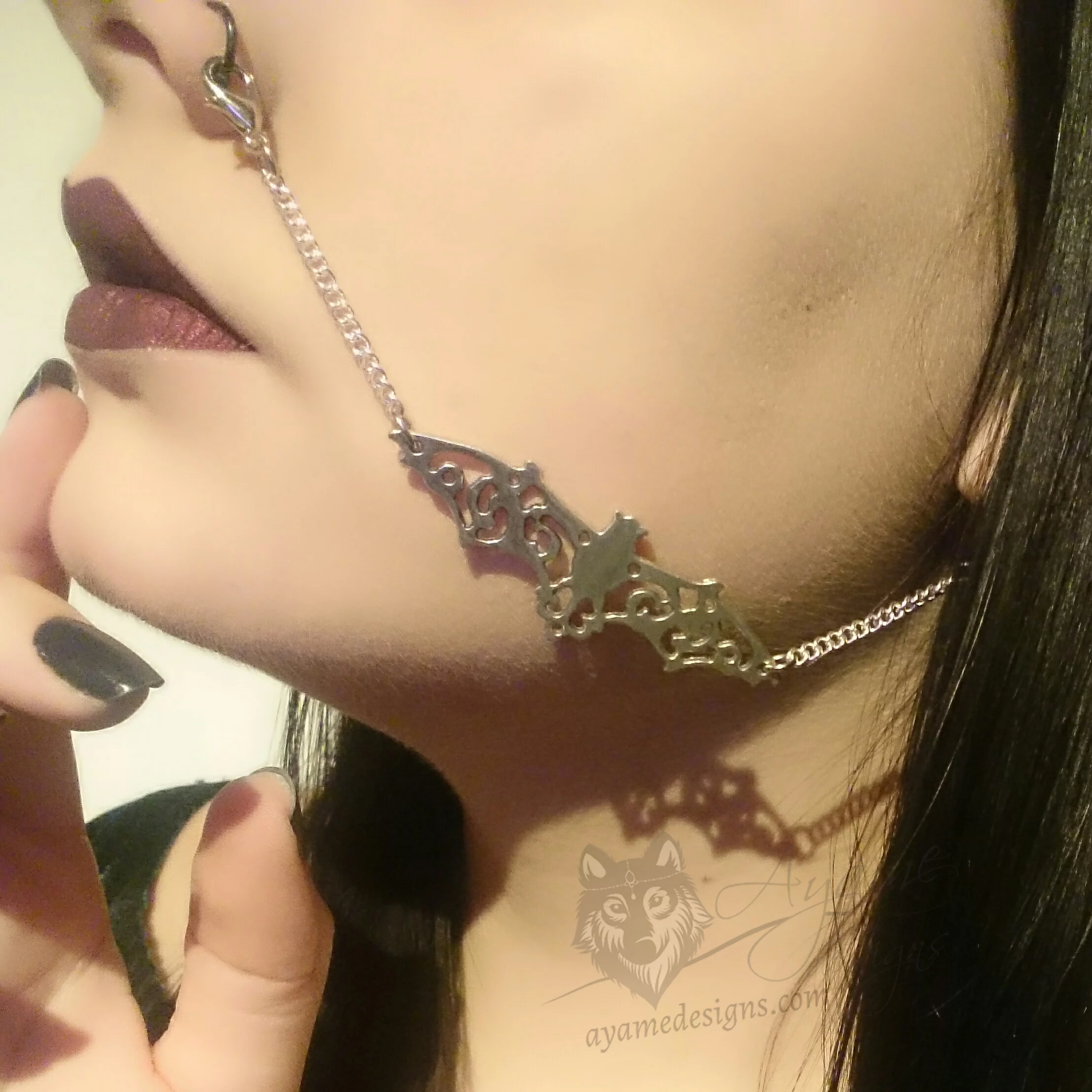 Handmade silver nose to ear chain with a filigree bat in the middle