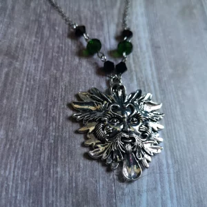 Handmade adjustable pagan necklace with a green man pendant, black and green Austrian crystal beads, and stainless steel chain