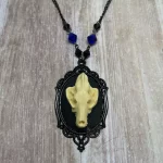 Handmade adjustable gothic necklace with a resin wolf skull in a black filigree frame, black and blue Austrian crystal beads and black stainless steel chain
