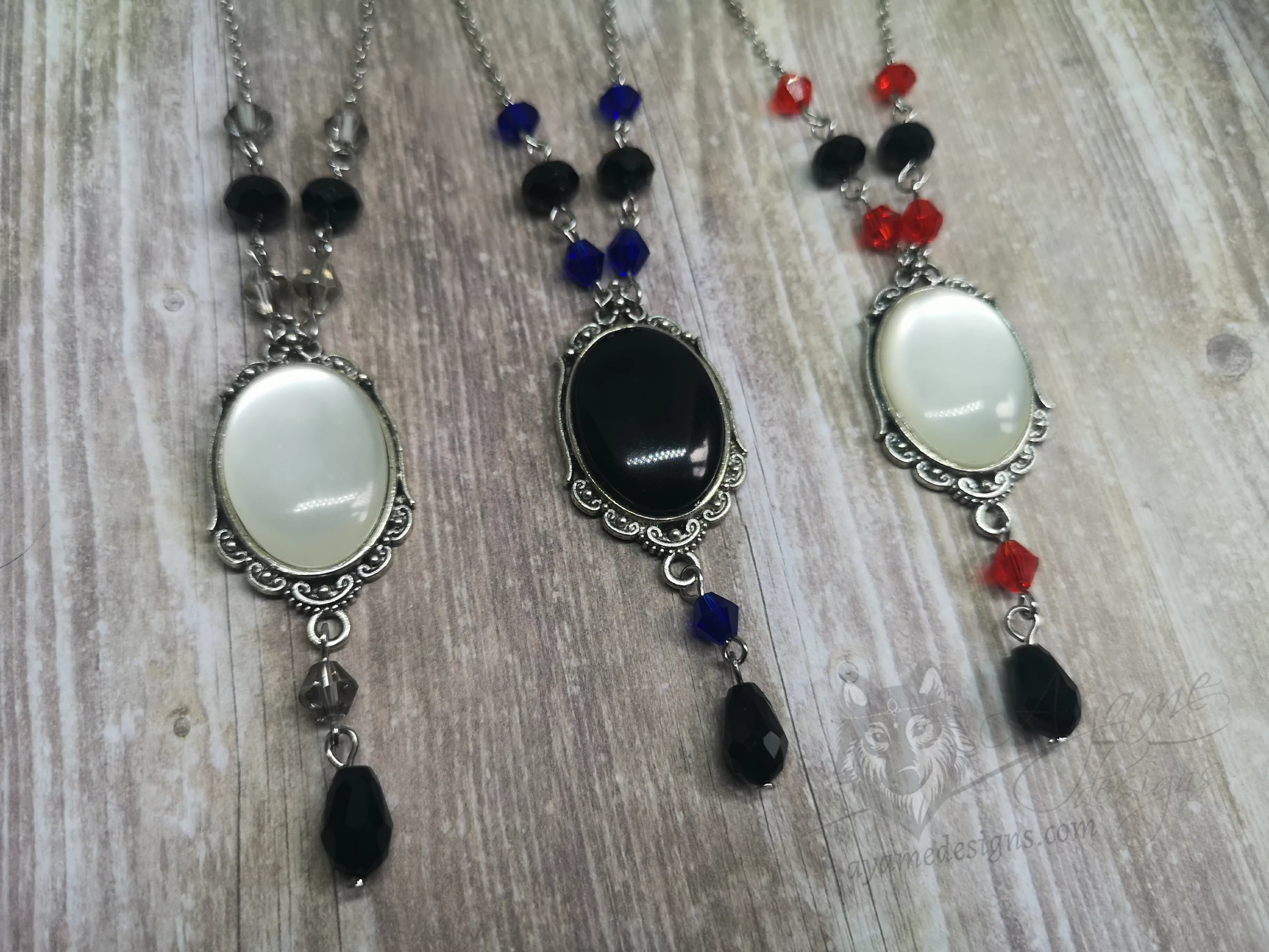 Handmade adjustable gothic necklace with a resin cabochon in a filigree frame, Austrian crystal beads and stainless steel chain