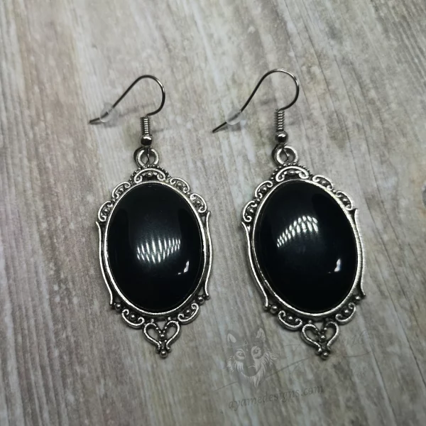 Elegant gothic earrings with black resin cabochons in silver filigree frames, on stainless steel earring hooks