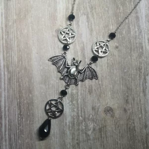 Adjustable gothic necklace with a large bat pendant, three pentacle pendants, and black Austrian crystal beads and stainless steel chain