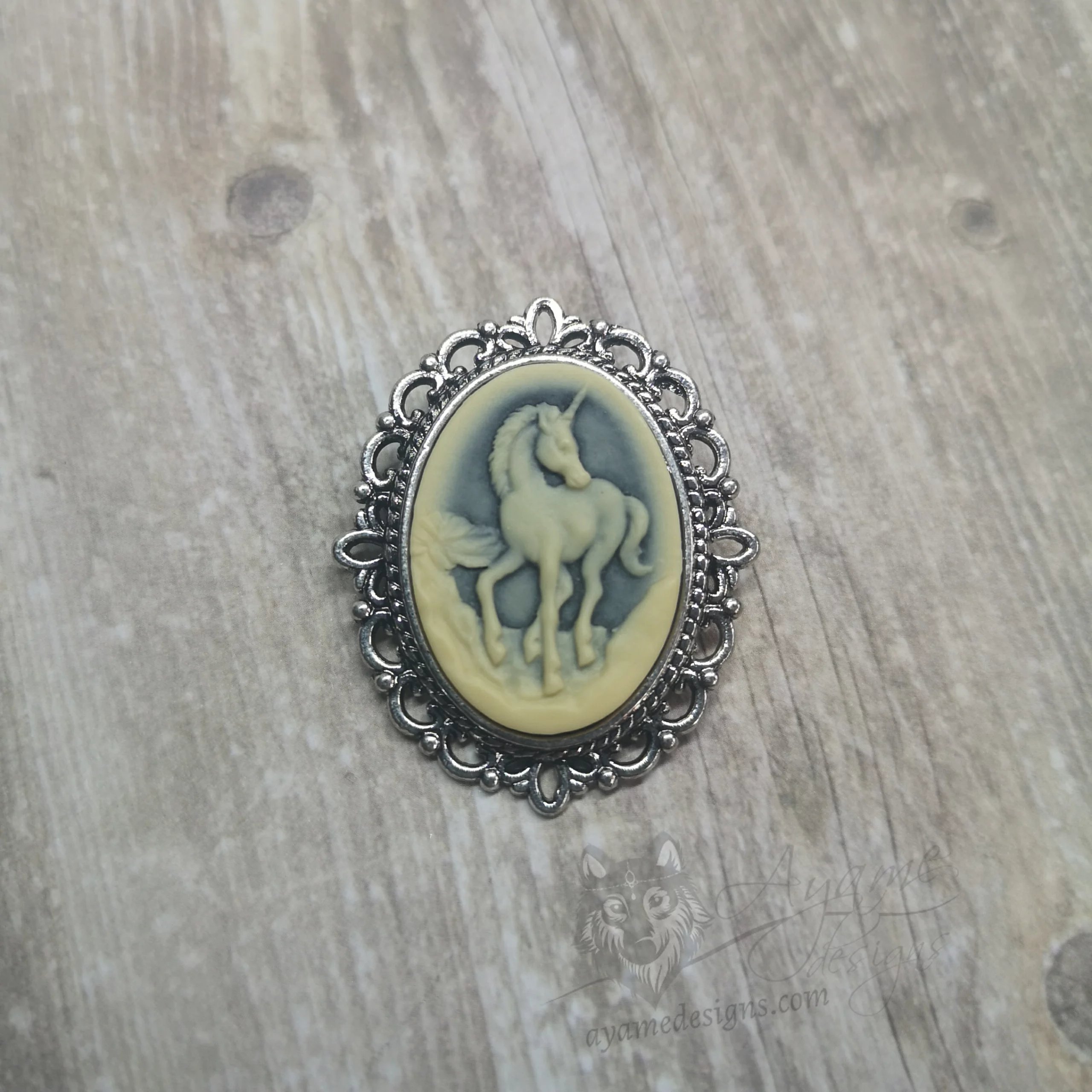 Small resin unicorn cameo brooch