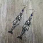 Handmade earrings with mermaid skeleton pendants and blue Austrian crystal beads on stainless steel earring hooks