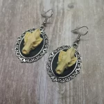 Handmade gothic earrings with resin wolf skulls in filigree frames on stainless steel earring hooks