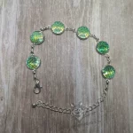 Adjustable stainless steel cabochon bracelet with light green resin mermaid scales