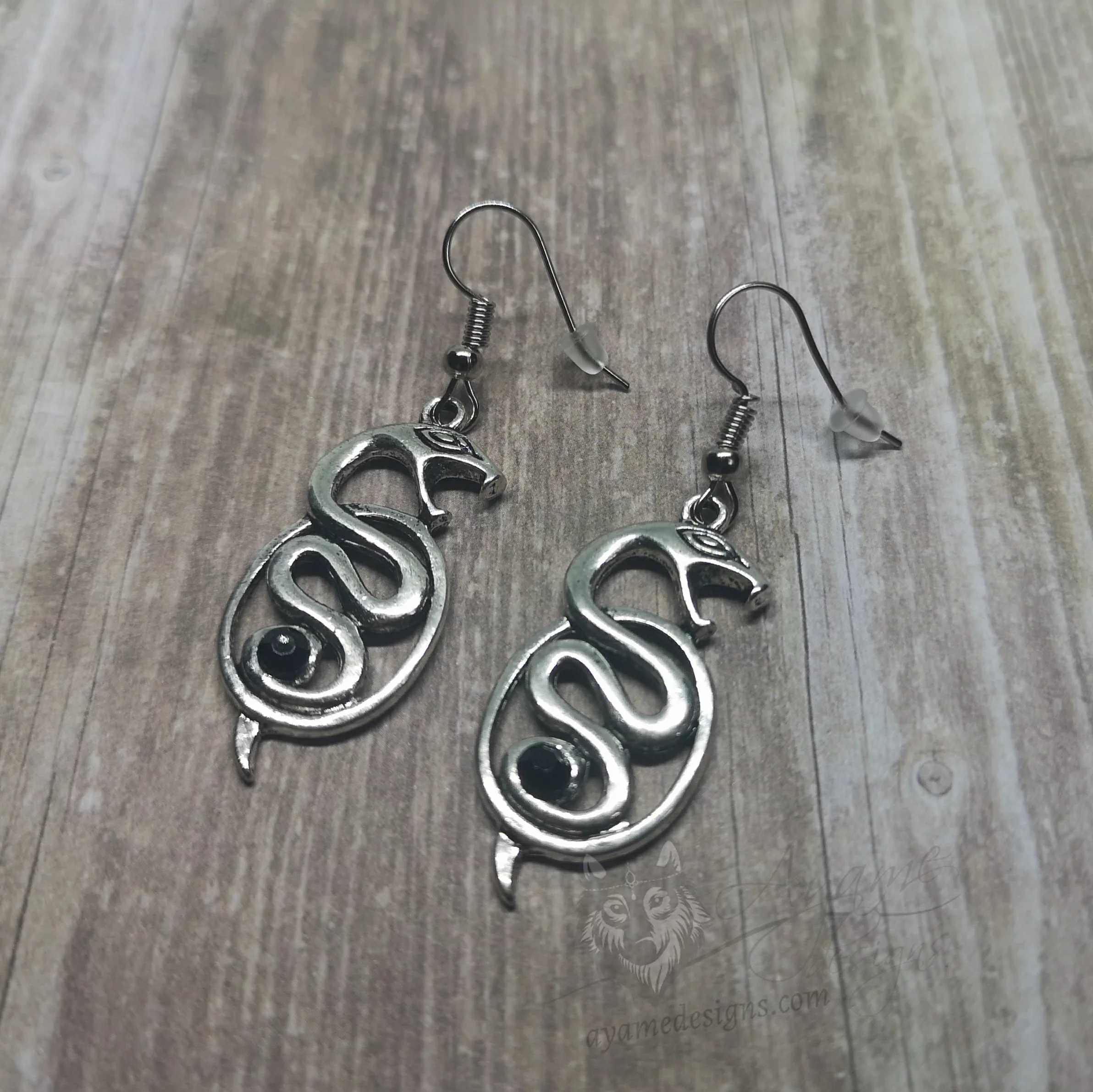 Handmade earrings with snake charms on stainless steel earring hooks