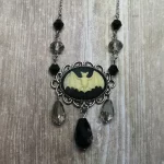 Adjustable gothic necklace with a bat cameo in a filigree frame, with black and grey Austrian crystal beads and stainless steel chain