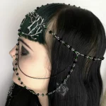 Handmade fantasy head chain with a black cabochon in a filigree chain, branch charms, green and black Austrian crystal beads and stainless steel chain