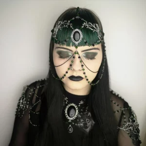 Handmade fantasy head chain and shoulder chain necklace with a black cabochon in a filigree chain, branch charms, green and black Austrian crystal beads and stainless steel chain