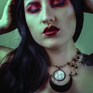 Gothic beaded choker necklace made of stainless steel with grey and black Austrian crystal beads, a glass moon cabochon pendant, and a large laser cut perspex crescent moon pendant