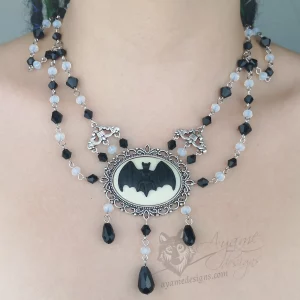 Handmade adjustable gothic choker necklace with white and black Austrian crystal beads and a large bat cameo in a filigree frame