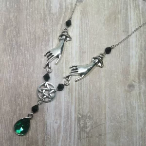 Adjustable necklace with hand pendants, a pentacle connector and a green teardrop charm