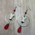 Handmade earrings with duck vertebrae inside large stainless steel rings, with red Austrian crystal beads, on stainless steel earring hooks