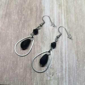 Handmade earrings with stainless steel teardrop charms, with black Austrian crystal beads, on stainless steel earring hooks