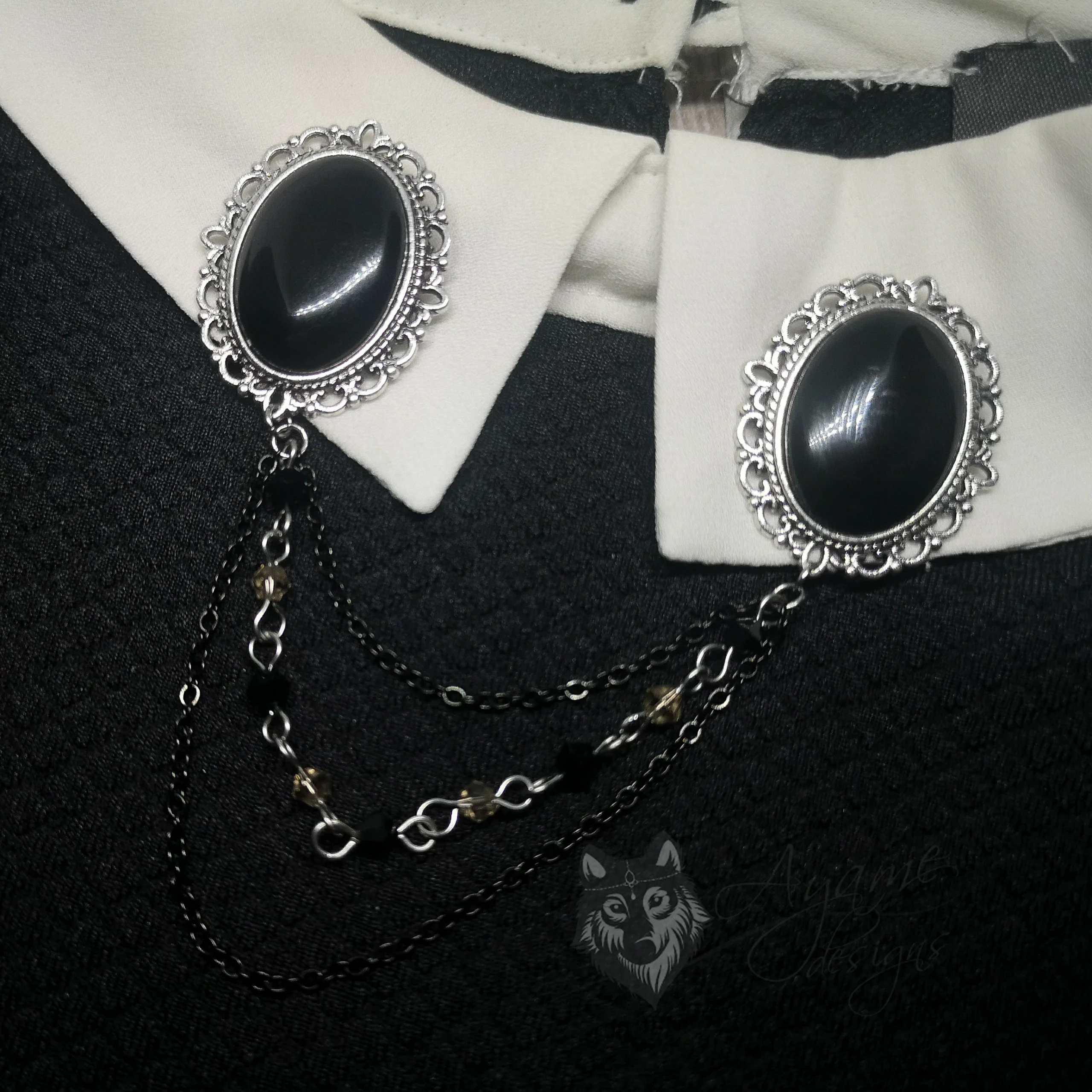 Collar pins with black resin cabochons in filigree frames, and 2 strands of chains and 1 strand of grey and black Austrian crystal beads