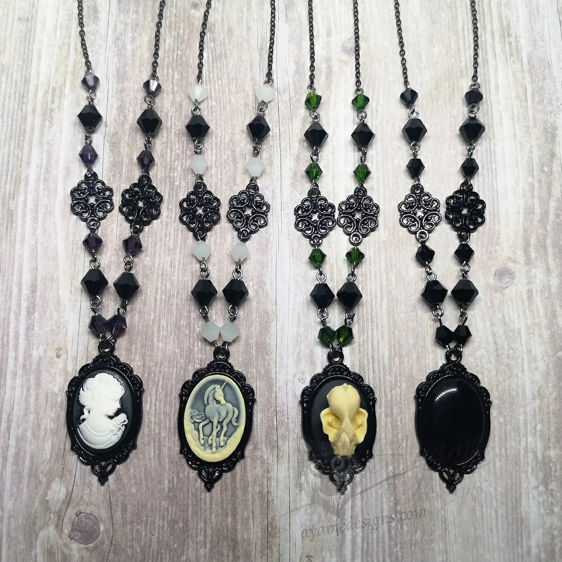 Handmade gothic necklace with a small resin cameo in a black filigree frame, Austrian crystal beads and black stainless steel chain