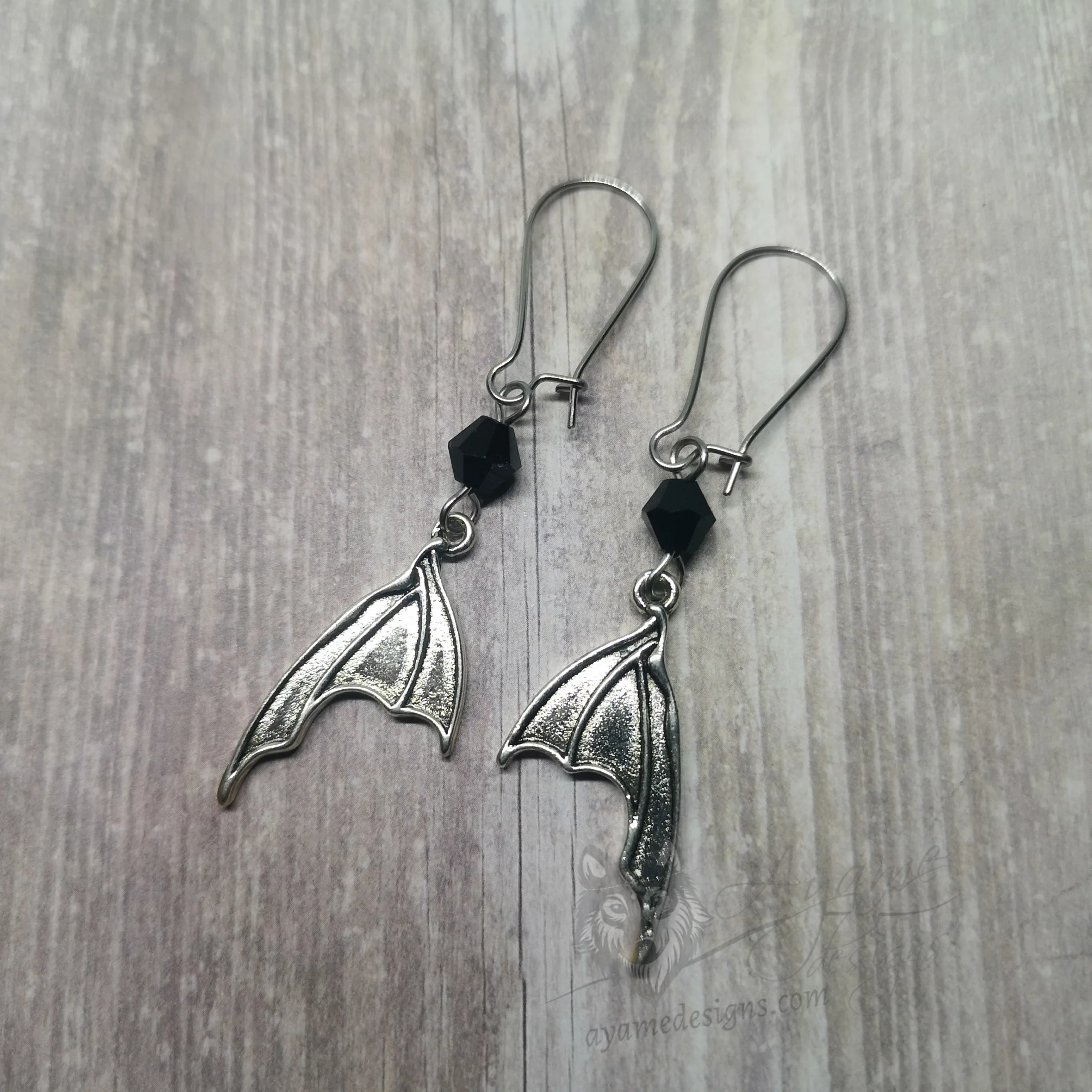Handmade gothic earrings with small bat wings and black Austrian crystal beads on stainless steel kidney earring hooks