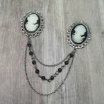 Collar pins with cameos in filigree frames, and 2 strands of chains and 1 strand of purple Austrian crystal beads