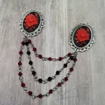 Collar pins with resin rose cameos in filigree frames, and 2 strands of red Austrian crystal beads, and 1 strand of black Austrian crystal beads