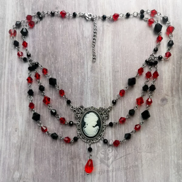 Handmade adjustable Victorian gothic choker necklace with red and black Austrian crystal beads and a cameo pendant in a filigree frame