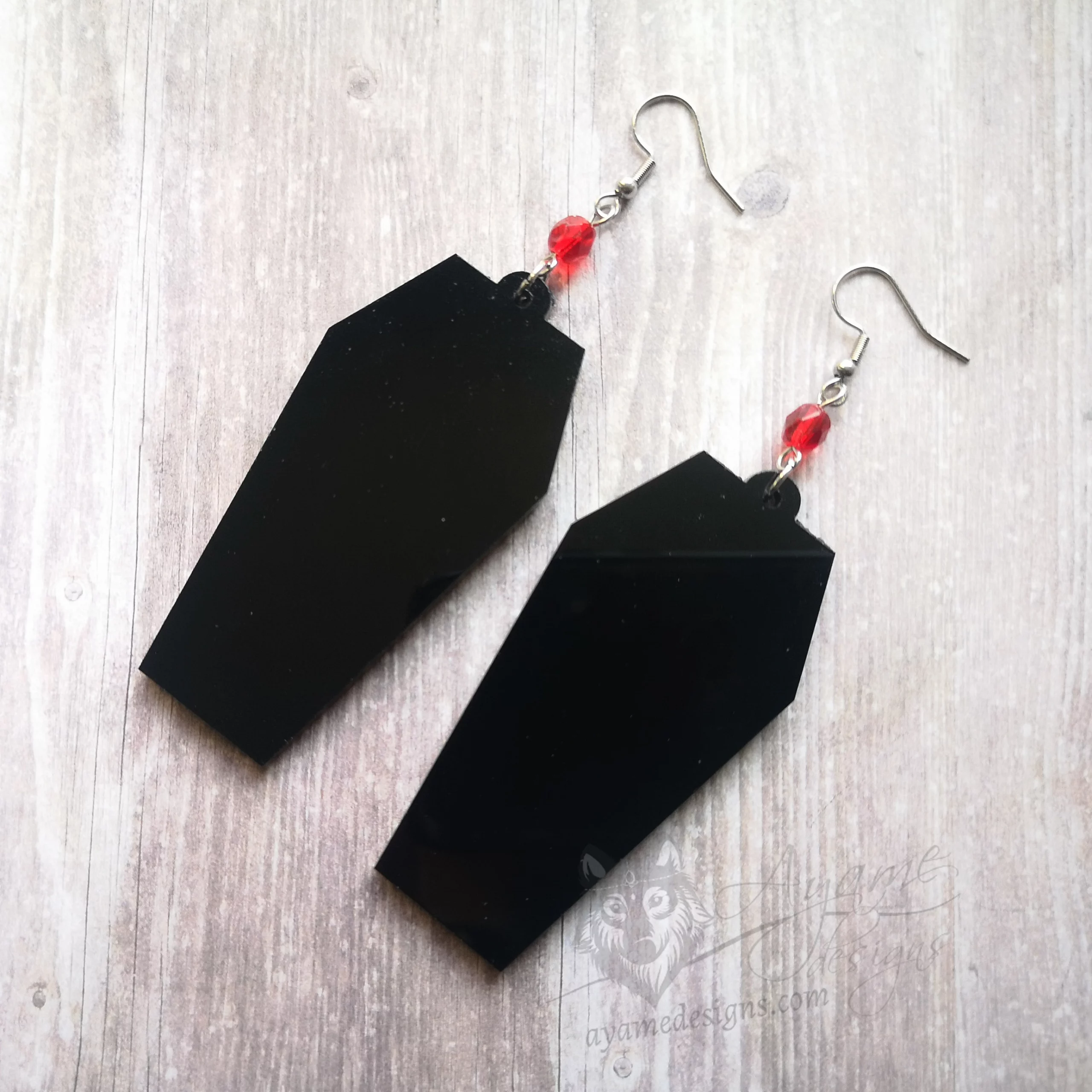 Handmade gothic earrings with laser cut perspex coffin pendants, red Czech crystal beads and stainless steel earring hooks