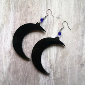 Handmade gothic earrings with laser cut perspex crescent moon pendants, blue Czech crystal beads and stainless steel earring hooks