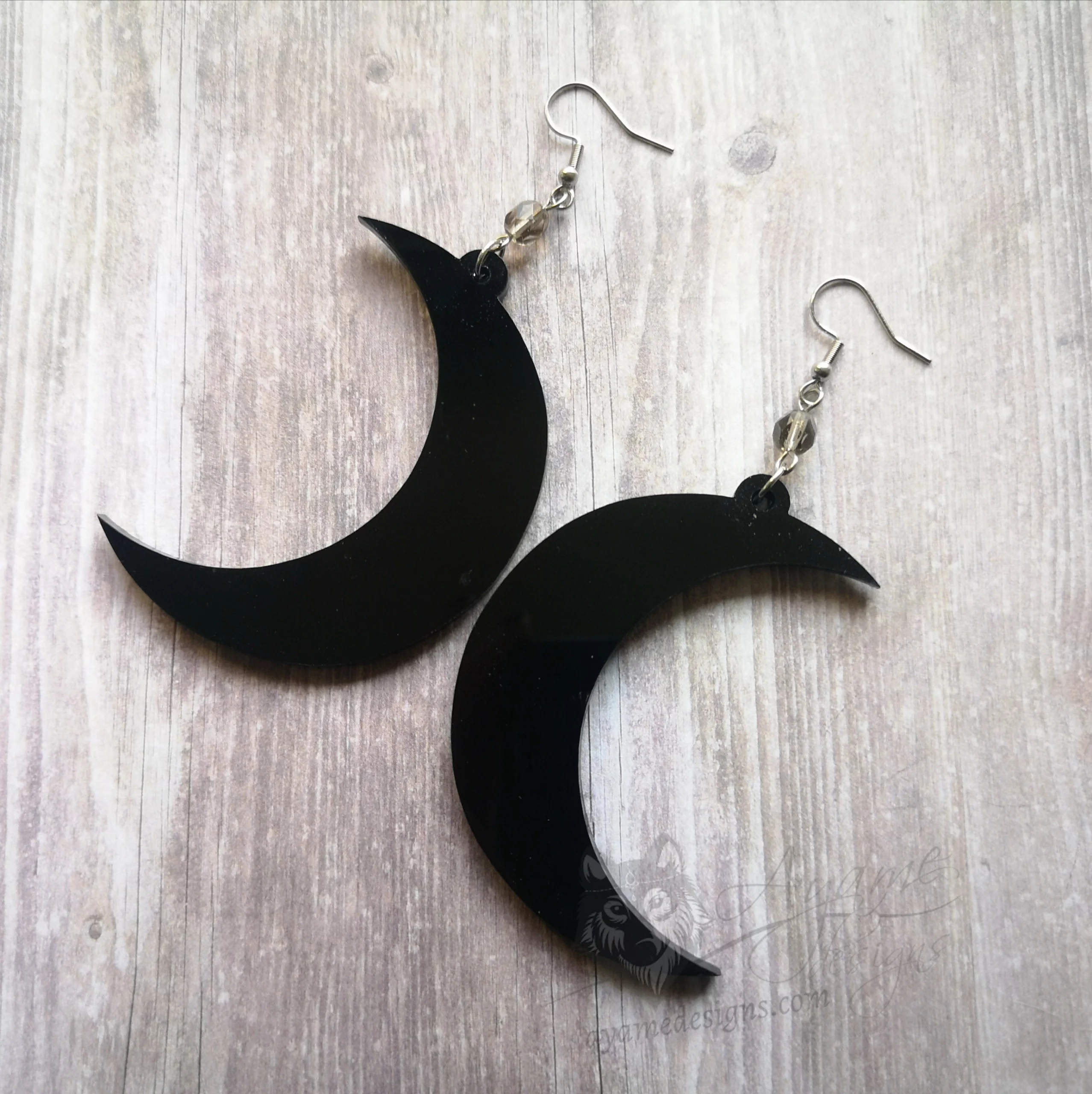 Handmade gothic earrings with laser cut perspex crescent moon pendants, grey Czech crystal beads and stainless steel earring hooks