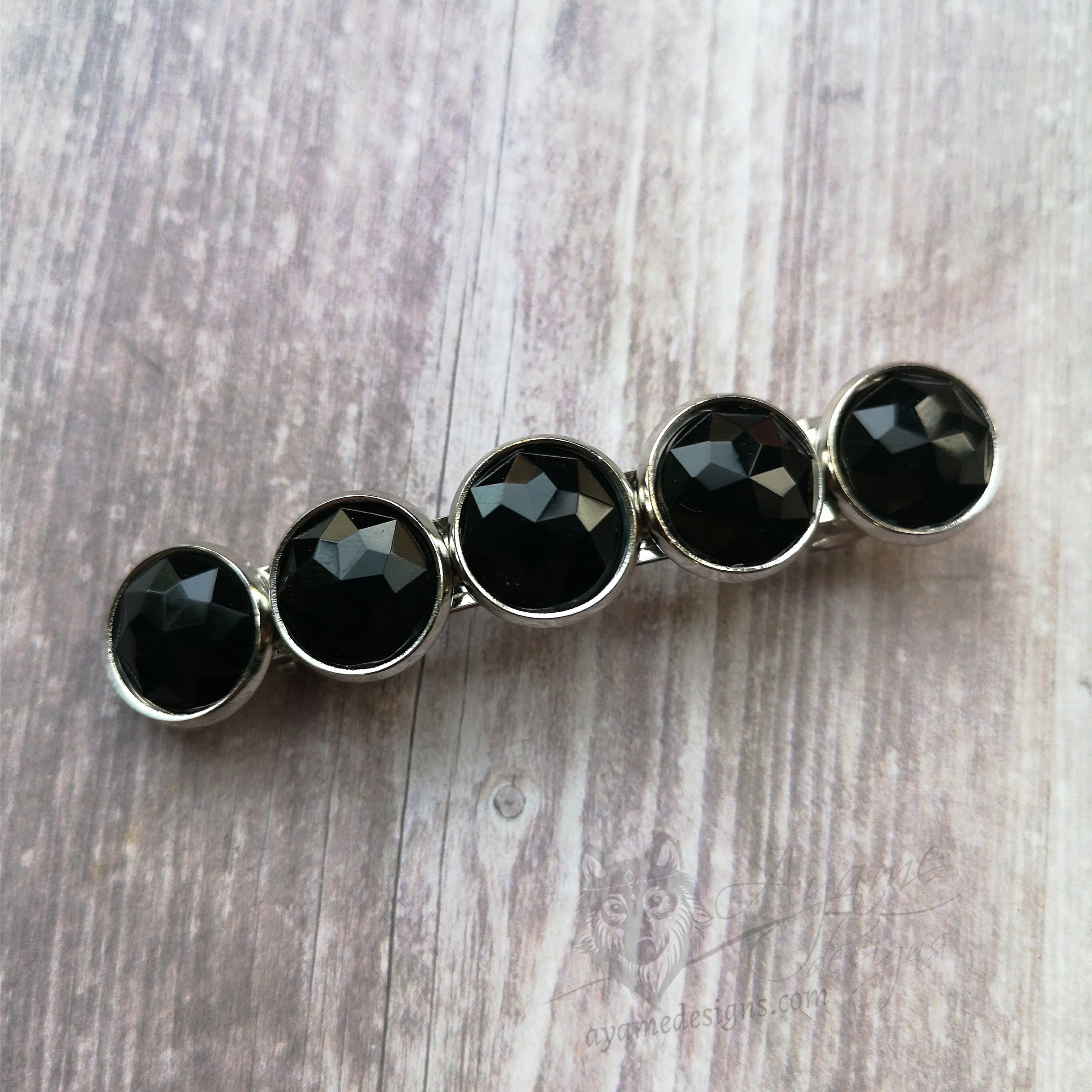 Hair barrette with black faceted resin cabochons