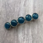 Hair barrette with blue and glitter resin cabochons