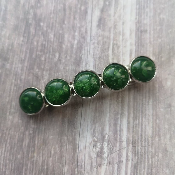 Hair barrette with green and glitter resin cabochons