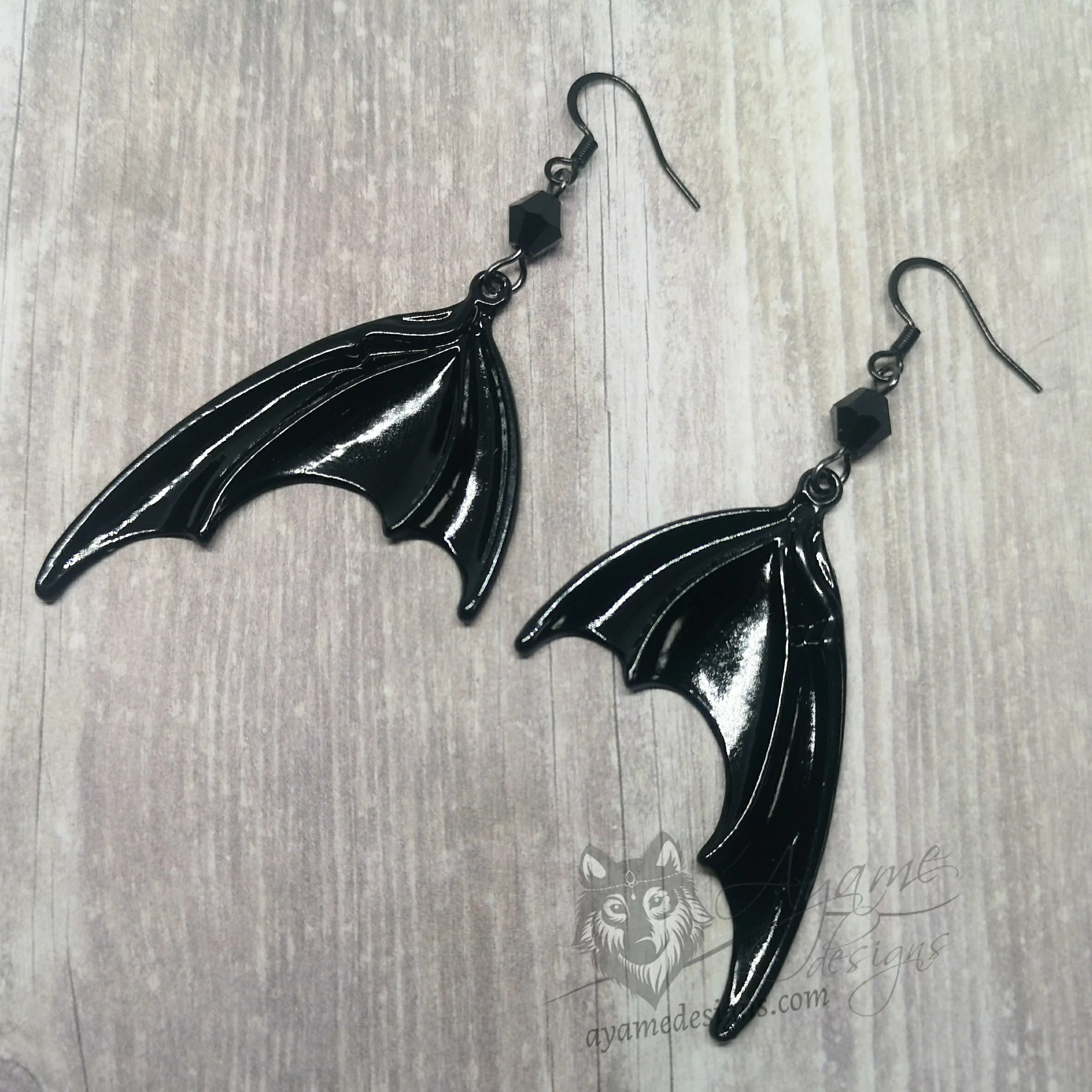 Handmade gothic earrings with large black bat wings and black Austrian crystal beads on stainless steel earring hooks