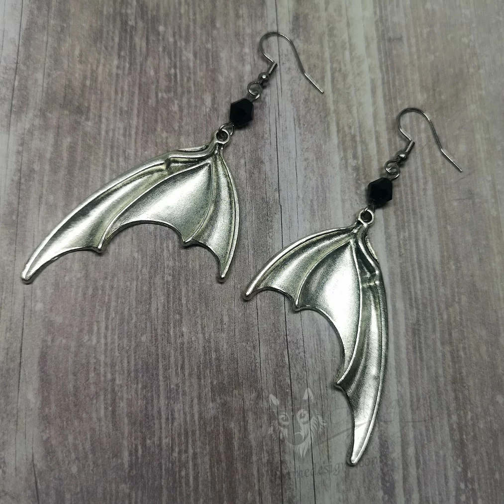 Handmade gothic earrings with large silver bat wings and black Austrian crystal beads on stainless steel earring hooks