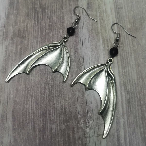 Handmade gothic earrings with large silver bat wings and purple Austrian crystal beads on stainless steel earring hooks