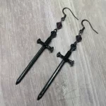 Handmade fantasy earrings with black sword pendants, purple Austrian crystal beads and stainless steel earring hooks