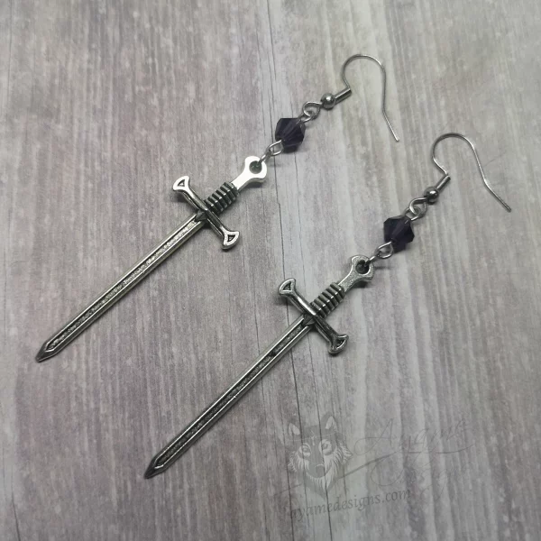 Handmade fantasy earrings with silver sword pendants, purple Austrian crystal beads and stainless steel earring hooks