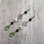 Handmade Victorian gothic earrings with filigrees, tiny snake vertebrae and black and green Austrian crystal beads on stainless steel earring hooks