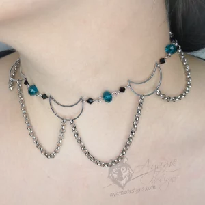 Handmade adjustable stainless steel choker necklace with stainless steel moons, black and teal Austrian crystal beads, and stainless steel chain details