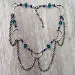 Handmade adjustable stainless steel choker necklace with stainless steel moons, blue and teal Austrian crystal beads, and stainless steel chain details