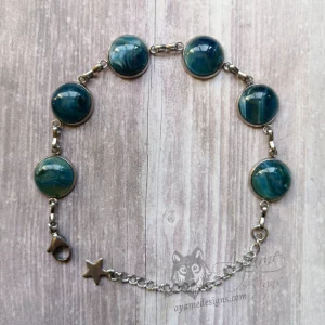 Adjustable stainless steel bracelet with small blue and green marble style resin cabochons