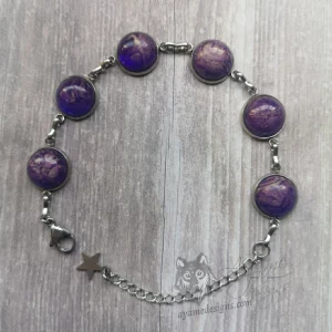 Adjustable stainless steel bracelet with small purple resin cabochons