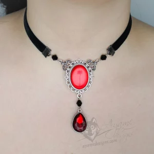 Handmade adjustable black velvet choker necklace with Austrian crystal beads, a large red resin cabochon pendant in a silver filigree frame, and a teardrop pendant