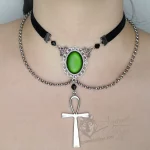 Handmade adjustable black velvet choker necklace with Austrian crystal beads, a large green resin cabochon pendant in a silver filigree frame, and an ankh pendant, with chain details
