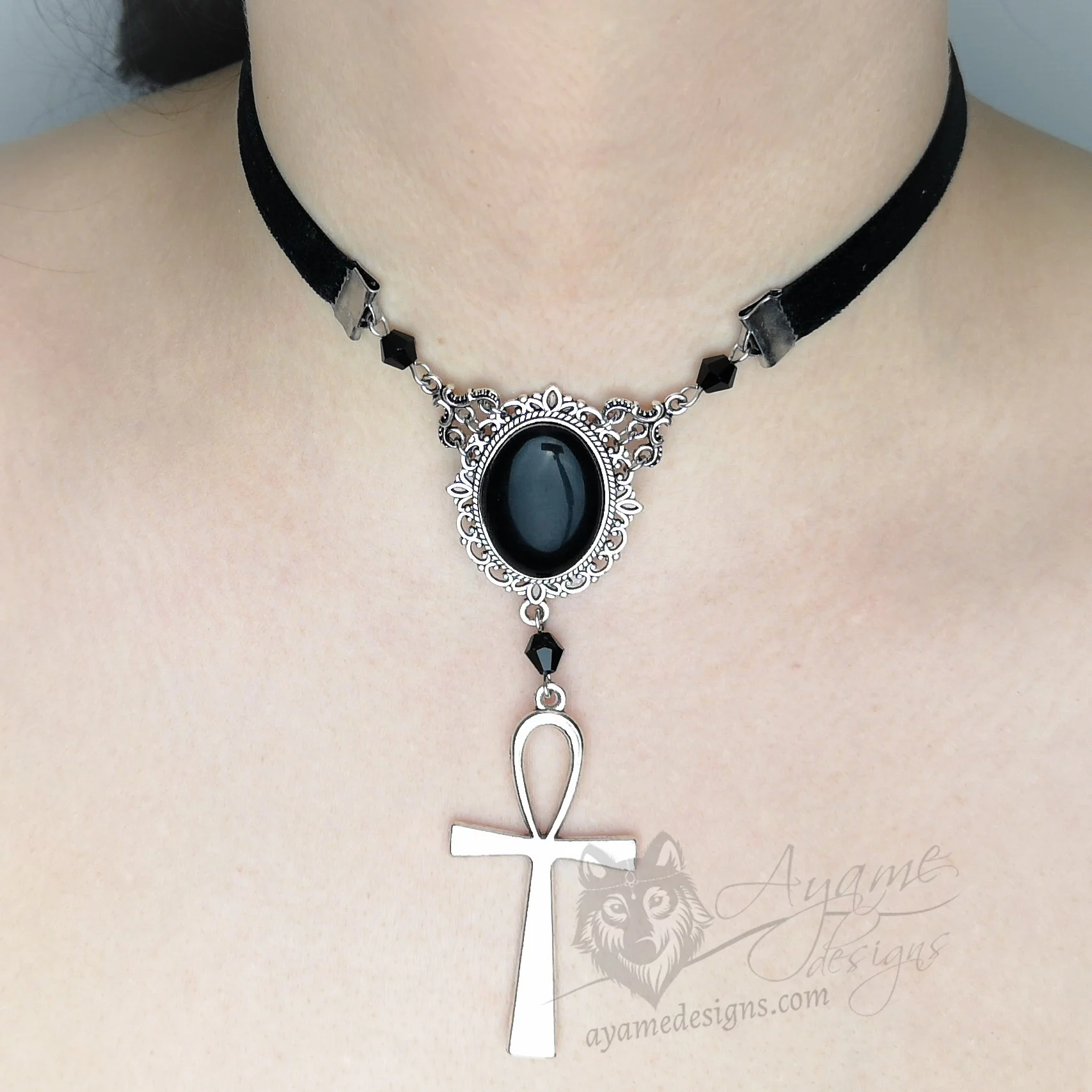 Handmade adjustable black velvet choker necklace with Austrian crystal beads, a large black resin cabochon pendant in a silver filigree frame, and an ankh pendant