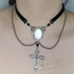 Handmade adjustable black velvet choker necklace with Austrian crystal beads, a large white resin cabochon pendant in a silver filigree frame, and a Byzantine cross pendant, with chain details